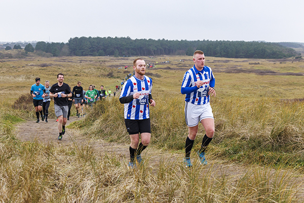 hardloop sport evenement Adventurerun Ameland 2023 21 kilometer met link naar fotoalbum